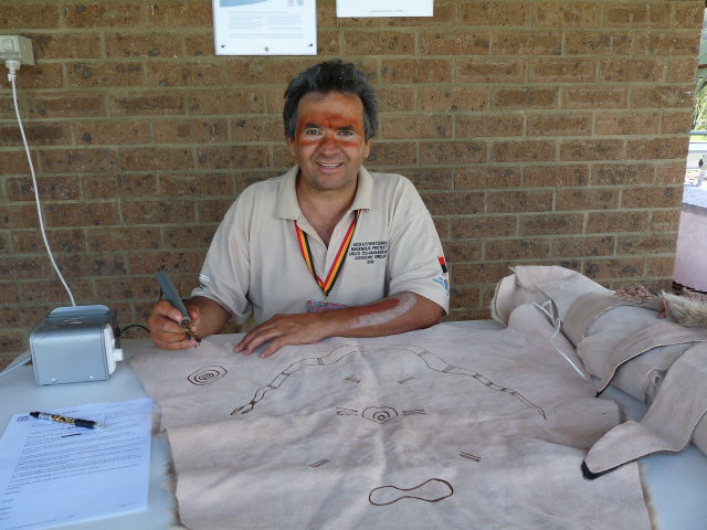 Wayne Krause, Artist using burnt wood engraving on Kangaroo skin